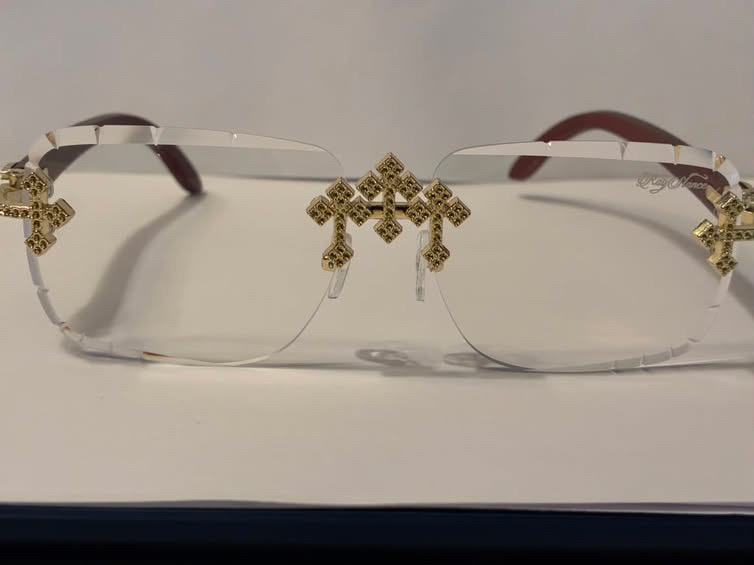 RayStance clear rimless frame with gold cross accents